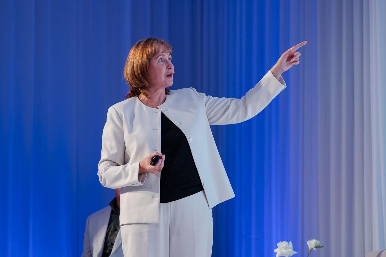 Dr Jenni Irvine presenting on stage